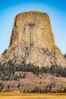 Devils Tower National Monument, a rare form of igneous rock, rises out of the Wyoming landscape. Art Print